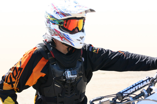 Image of rider wearing Fox ProFrame and Leatt neck brace; GoPro Hero 3 is front-mounted using the Moto Flak Mount